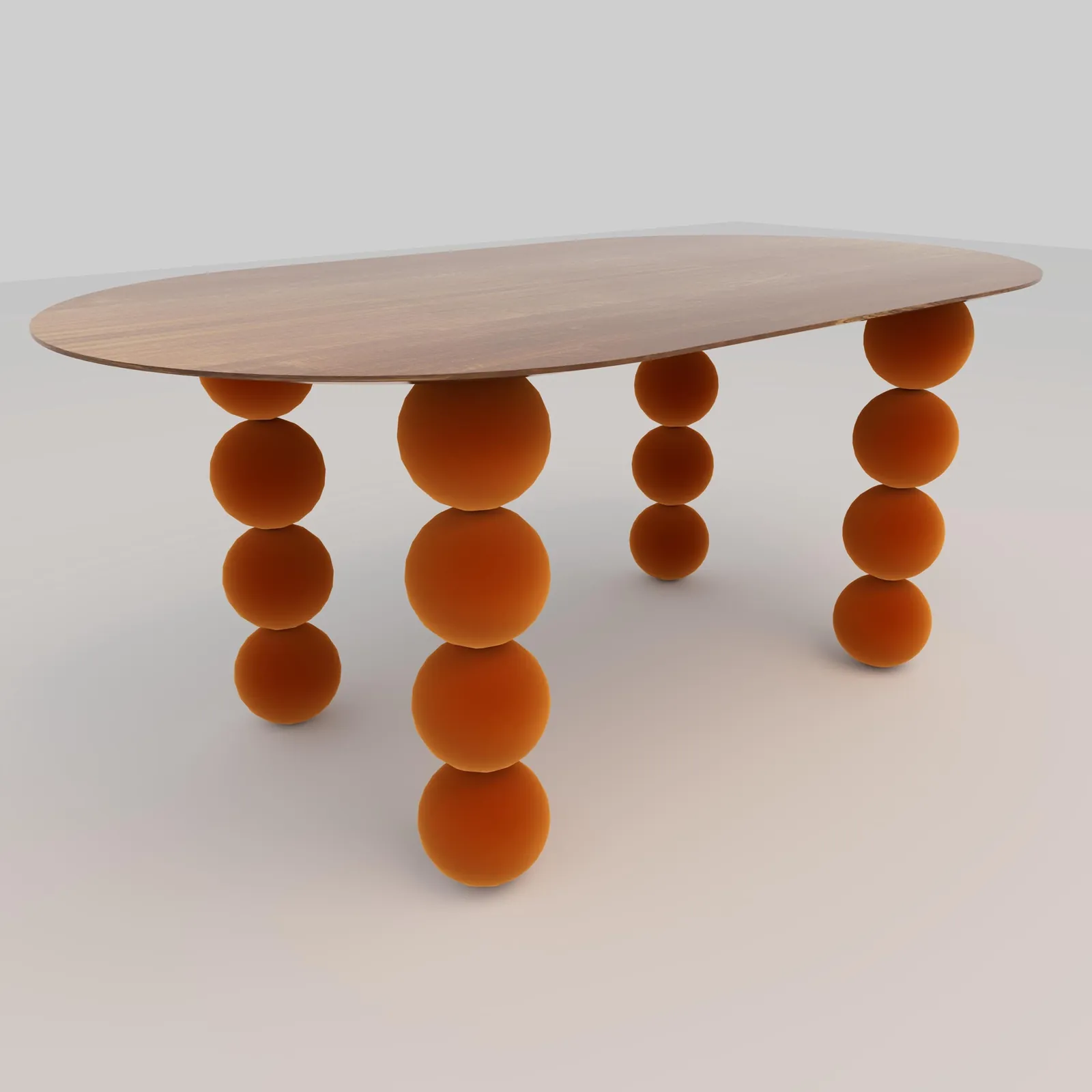 The Orbital dinette table with an oval wooden top on orange velvet sphere legs