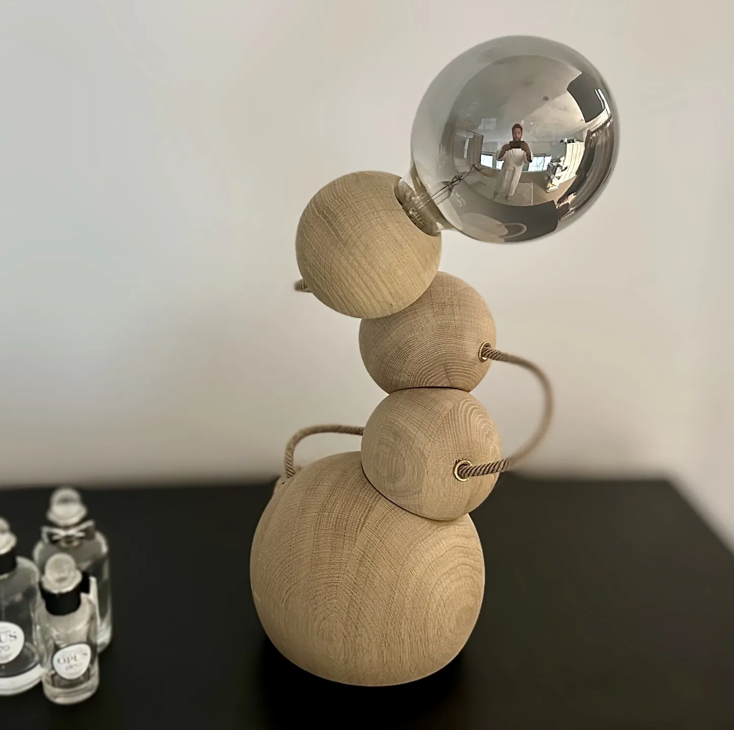 The Orbital table lamp with a silver globe bulb